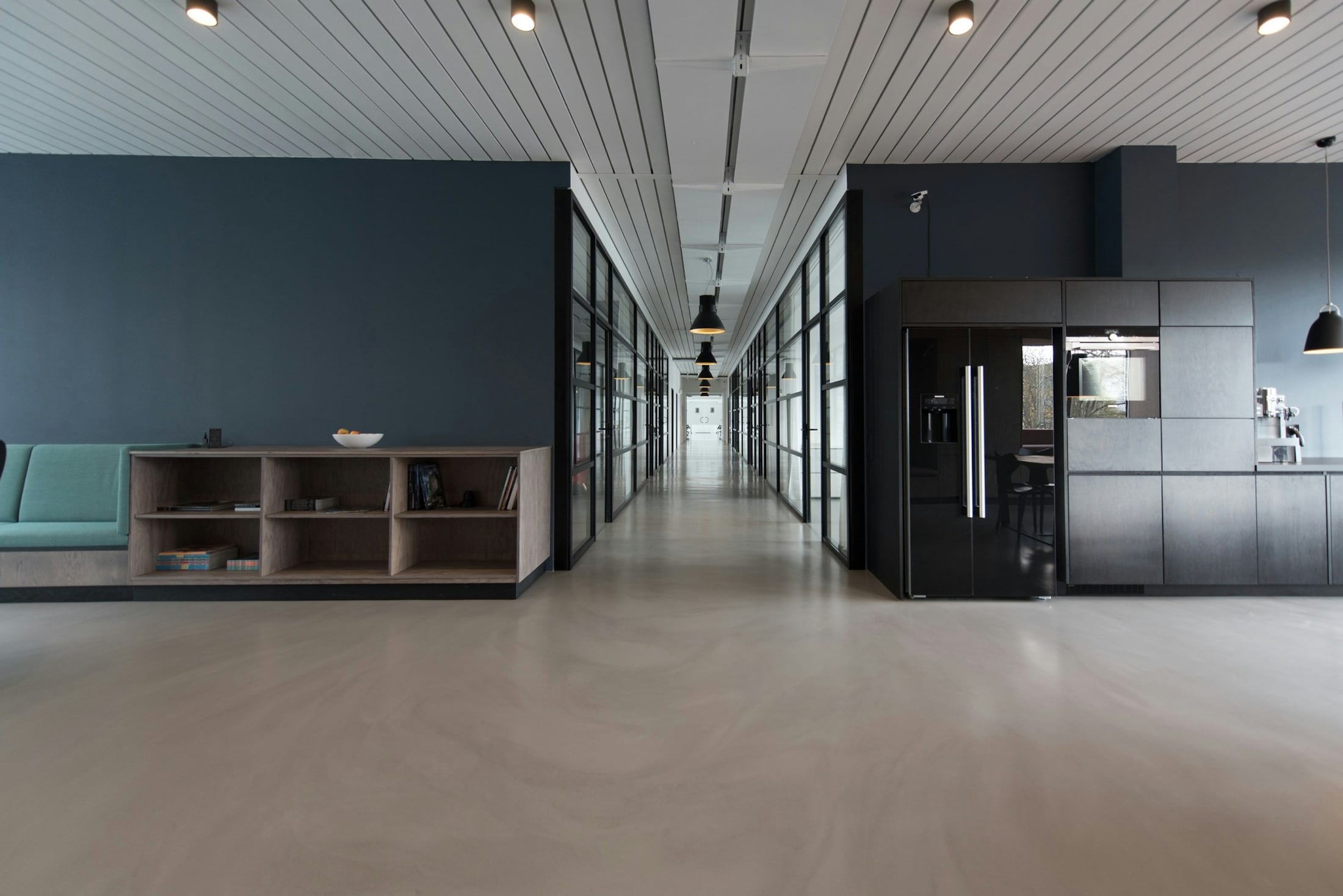 Quiet editorial office interior with warm architectural light